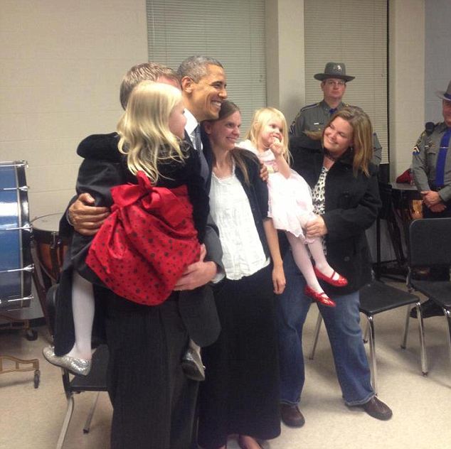 Family photo: Mr Obama joined the parents and their two remaining daughters 