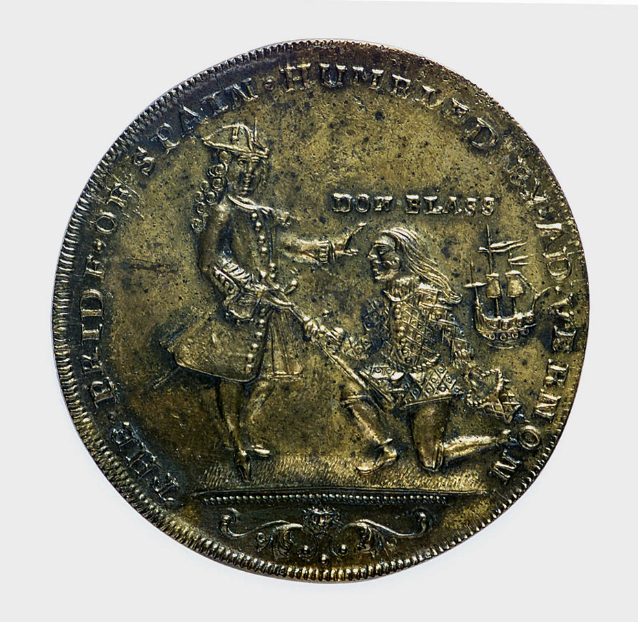 Медаль, выбитая в Англии заранее, в честь так и не состоявшегося взятия Картахены. На изображении адмирал Вернон принимает капитуляцию у коленопреклонённого Блаза де Лезо