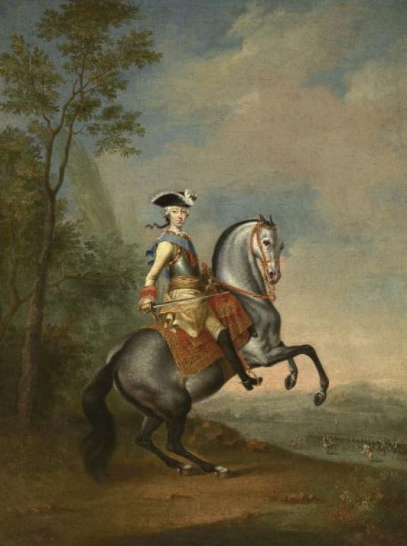 Портрет юного Юрия на коне с шашкой в руках.
