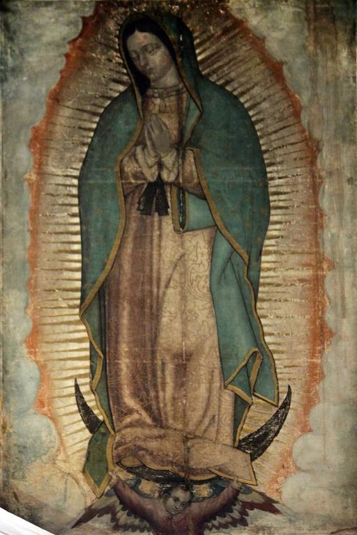  Nuestra Senora de Guadalupe, считающийся нерукотворным образ из Базилики Девы Марии Гваделупской, Мехико. Дева Мария здесь представлена красивой девушкой индейского происхождения